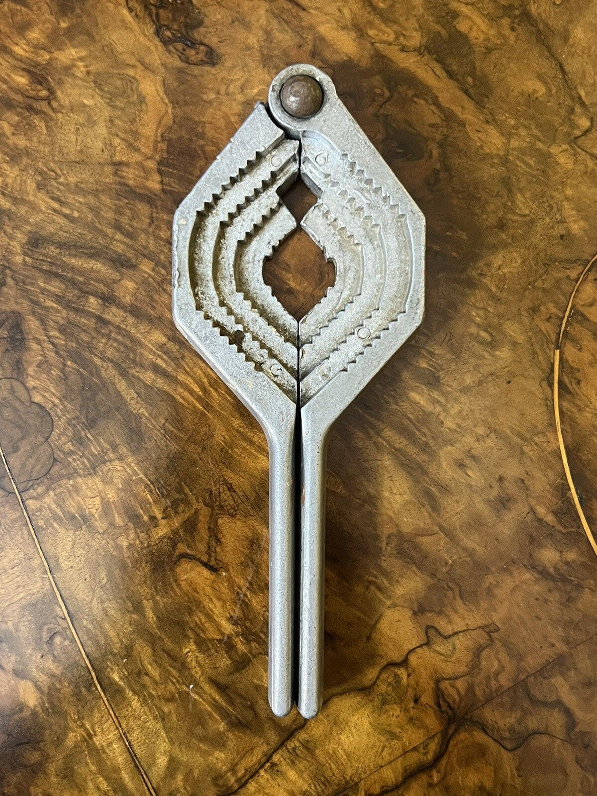 Distinctive Top Off Nut Cracker Bottle Opener