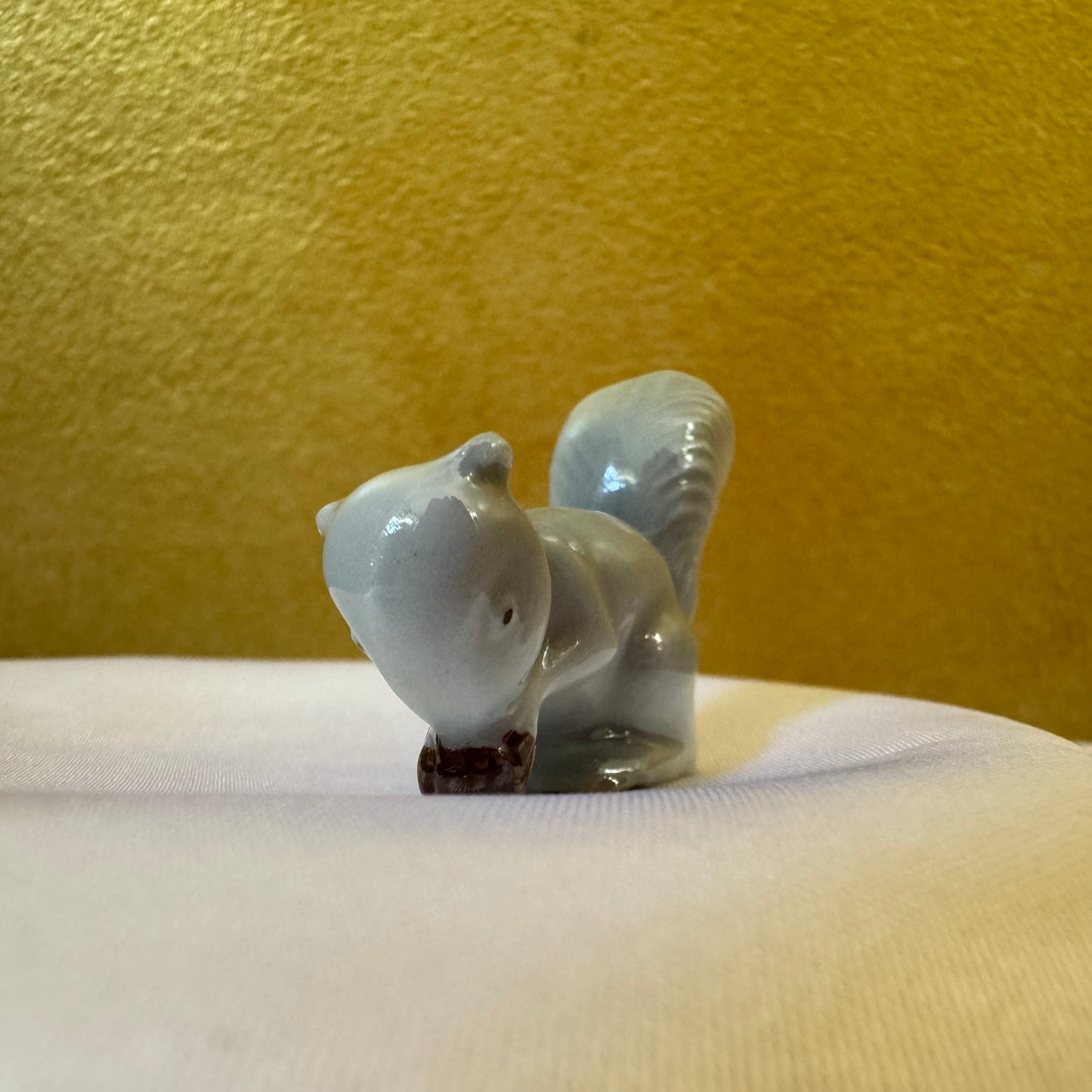 Miniature Squirrel Eating A Nut 