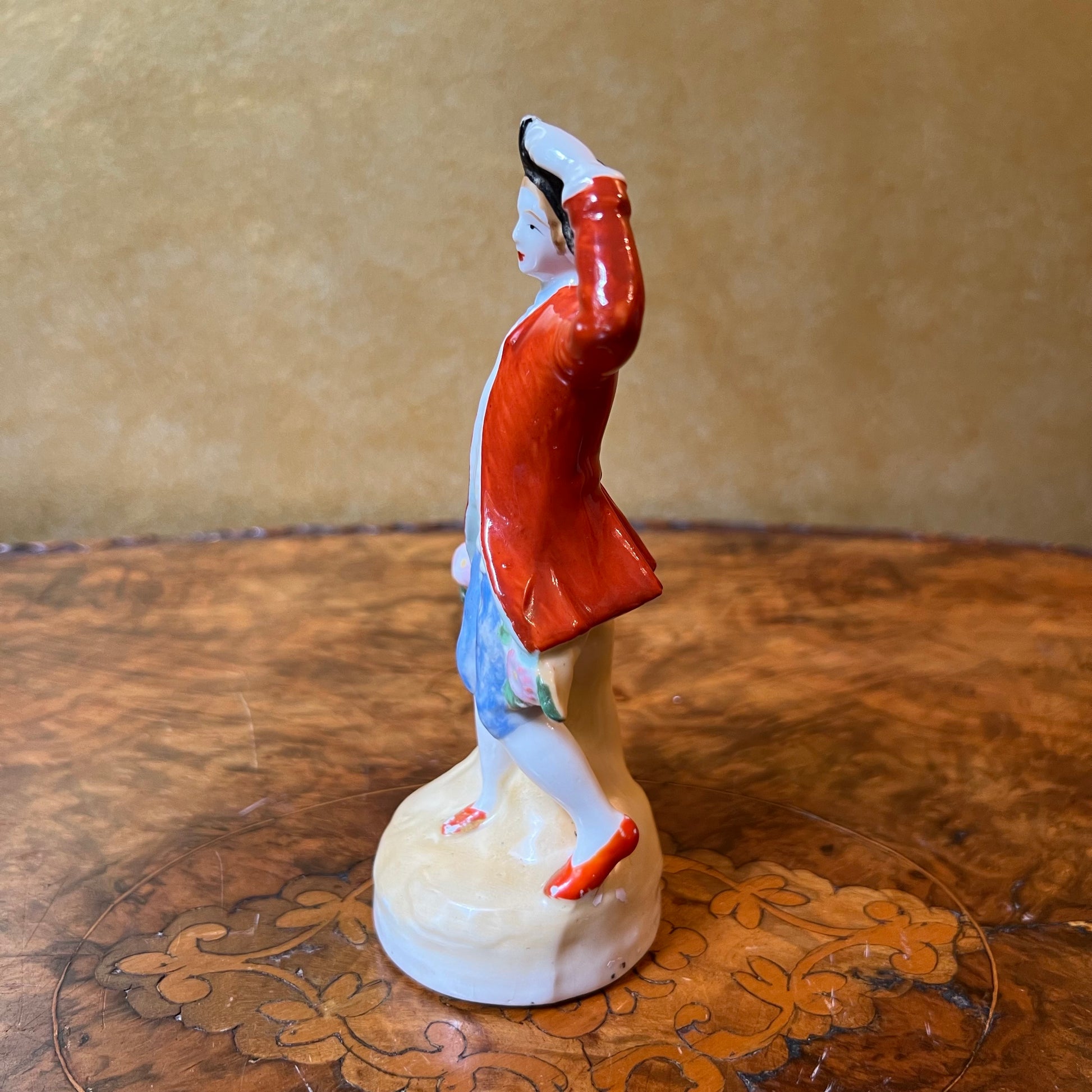 Red Coat Man Figurine Statue 